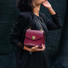 Woman Posing With The Bordeaux Small Leather Shoulder Bag