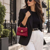 Beautiful Woman In The Street Carrying The Red Small Leather Shoulder Bag