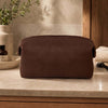 Small Leather Toiletry Bag in premium Italian leather on a marble countertop with grooming essentials.