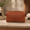 Small Leather Toiletry Bag made from premium Italian leather, perfect for transporting grooming essentials.