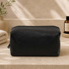 Leather Wash Bag made from premium Italian leather, featuring a zip top closure and framed outer design.