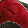 Interior view of the Soft Leather Backpack showing red lining and pockets.