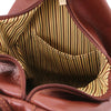 Interior view of the Luxury Leather Backpack showing striped cotton lining and pocket details.