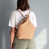 Woman Posing With The Caramel Soft Leather Backpack