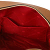Interior view of the Women’s Soft Leather Backpack showcasing the red lining and pocket organization.
