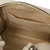 Interior view of the Women’s Soft Leather Backpack showing pockets and light taupe lining.