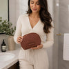 Woman Holding The Brown Soft Leather Toiletry Case