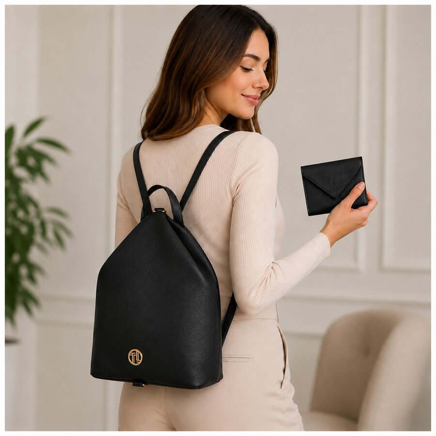 Woman wearing a black soft leather backpack with matching wallet for an anniversary gift