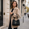 Woman In The Street Holding The Black Soft Leather Handbag 