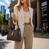 Woman In The Street Holding The Chocolate Soft Leather Handbag 