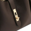 Soave Soft Leather Handbag in Chocolate close-up of gold lock detail on luxurious pebbled leather exterior.