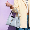 Woman Posing With The Light Blue Soft Leather Handbag