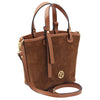 Angled And Shoulder Strap View Of The Cognac Suede Leather Handbag