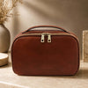 Toiletry Bag made of premium leather with antique brass hardware and a cotton lining.