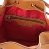 Internal Zip Pocket View Of The Cognac Leather Bucket Bag