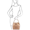 Woman Posing With The Champagne Leather Bucket Bag