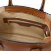 Interior view of the Womens Leather Handbag showcasing the spacious compartment and zipper pocket.