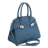 Womens Leather Handbag and Toiletry Case Set featuring a stylish denim handbag with gold accents.