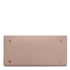 Womens Leather Handbag in soft nude leather with metal accents and studs on the bottom