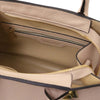 Interior view of a Womens Leather Handbag showing the zipper pocket and soft lining.