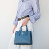 Woman Holding The Denim Womens Leather Tote