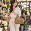 Woman At A Flower Market Carrying The Carmel Womens Bag