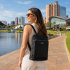 Leather Backpack Ladies worn by a woman with city skyline in the background, showcasing its stylish and practical design.