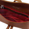 Internal Zip Pocket View Of The Cognac Womens Leather Clutch