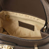 Inside view of dark taupe Womens Leather Tote Bag featuring cream lining and zip pocket.