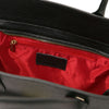 Inside view of a Womens Leather Shopper Bag featuring a spacious compartment and red lining with zipper pocket.