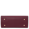 Underneath View Of The Womens Leather Shopper Bag in rich bordeaux pebbled leather with gold accents, showcasing a sleek design.