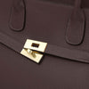 Close-up of a Womens Leather Shopper Bag featuring a gold-plated clasp and textured chocolate leather.
