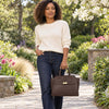 Women carrying a Womens Leather Shopper Bag in a beautiful garden setting.