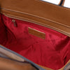 Interior view of the Womens Leather Shopper Bag showing the red lining and zip pocket.