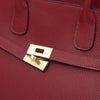 Close-up of a Womens Leather Shopper Bag featuring a gold-plated clasp and textured red leather.