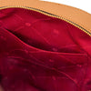 Interior view of the Woven Leather Backpack showcasing its elegant red lining and pocket.