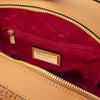 Interior view of the Woven Leather Backpack, showcasing spacious compartment and zippered pocket.