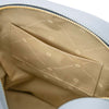 Interior view of the Woven Leather Backpack showcasing the spacious compartment and pocket.