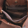 Internal Zip Pocket View Of The Cinnamon Woven Leather Bag