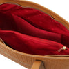 Interior view of Woven Leather Shopping Bag showing red lining and pockets, highlighting the spacious design of the Woven Leather Shoulder Bag.