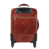 Rear View Of The Brown 4 Wheeled Luggage Trolley Bag Of The 4 Wheeled Luggage And Leather Laptop Briefcase Set