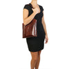Women Posing Over The Shoulder View Of The Brown Convertible Backpack Handbag