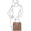 Women Posing With The Light Taupe Fortuna Vertical Leather Handbag
