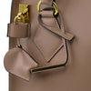 Locking And Key View Of The Light Taupe Fortuna Vertical Leather Handbag