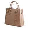 Angled View Of The Light Taupe Fortuna Vertical Leather Handbag