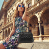 Women Posing With The Black Quilted Leather Handbag