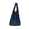 Side On View Of The Navy Blue Leather Handbag With Shoulder Strap