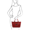 Women Posing With The Red Designer Leather Handbag