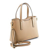Angled And Shoulder Strap View Of The Champagne Ladies Small Leather Handbag