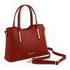 Angled And Shoulder Strap View Of The Red Ladies Small Leather Handbag